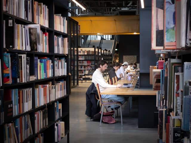 qualities of successful students studying productively in college library